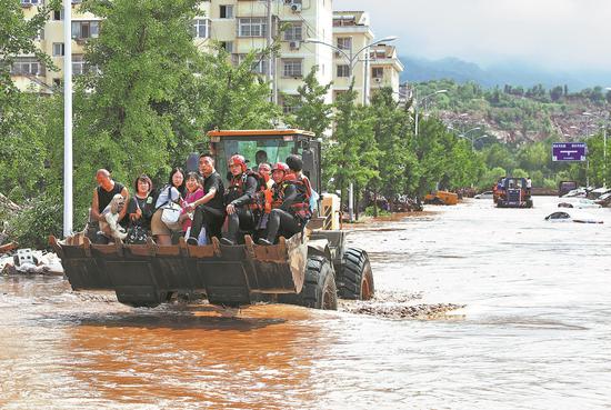 Xi urges all-out flood relief efforts